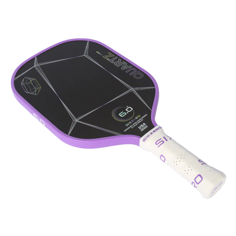 Purple and black pickleball paddle with white handle on a white background