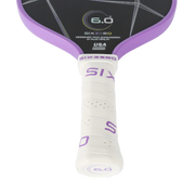 Close-up of a Sixzero paddle with purple and white design on a white background