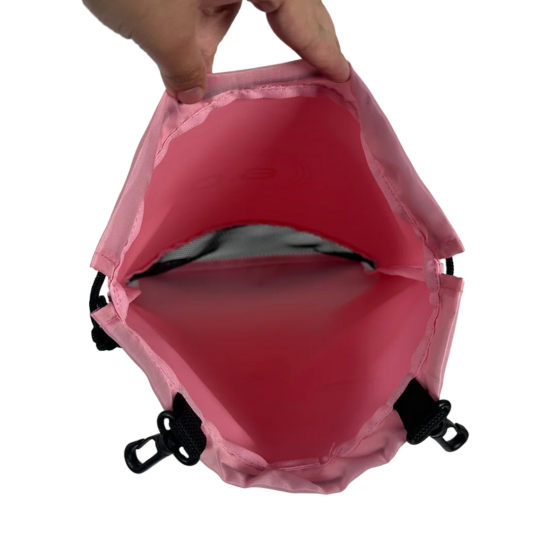 Pink drawstring bag with a hand pulling on the top, white background