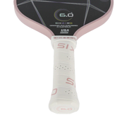Close-up of a pink and black paddle with 'SixZero' branding on a white background