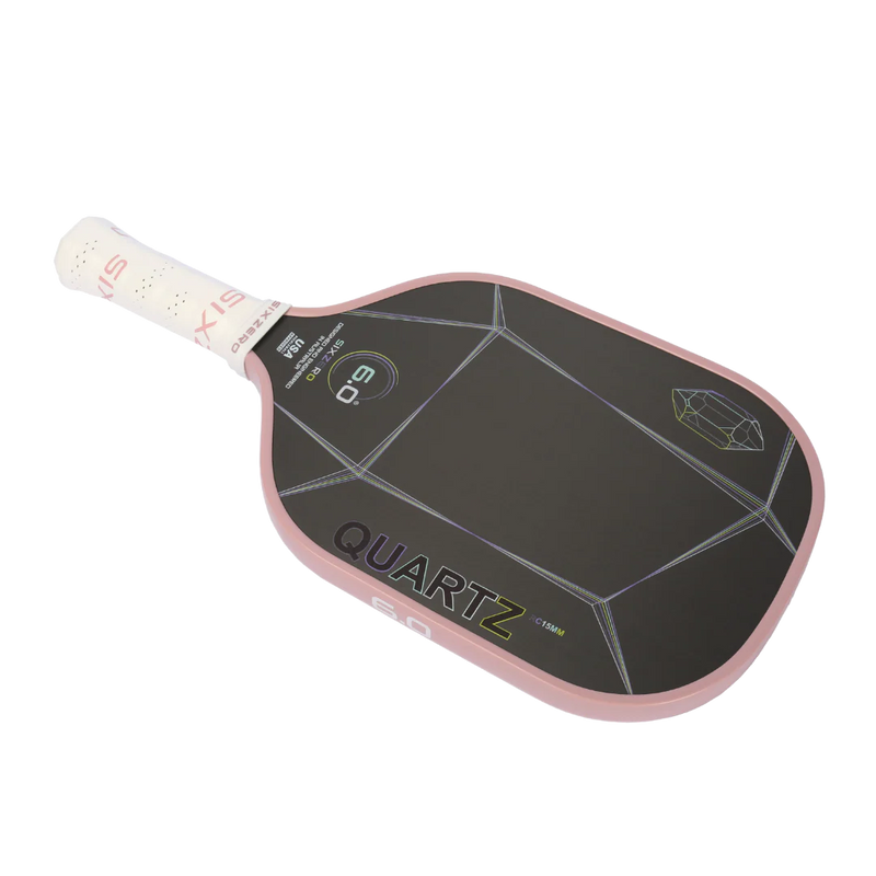 Pickleball paddle with 'Quartz' branding on a white background
