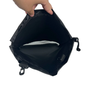 Black bag with a hand holding it open on a white background