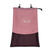 Pink drawstring bag with a black mesh bottom on a white background