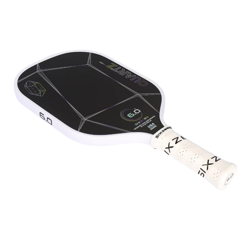 Pickleball paddle with black face and white handle on a white background