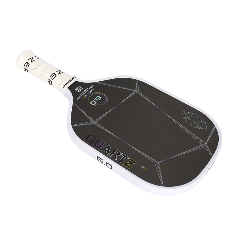Pickleball paddle with 'Quartz' branding on a white background
