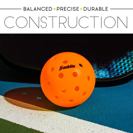 Orange pickleball with Franklin branding on a blue and black background