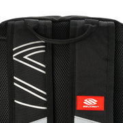 Close-up of a black backpack with a red Selkirk logo on a white background