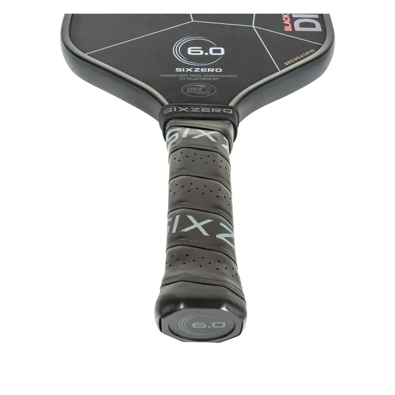 Close-up of a SixZero pickleball paddle on a white background