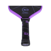 Close-up of a purple and black paddle with 'Sixzero' branding on a white background