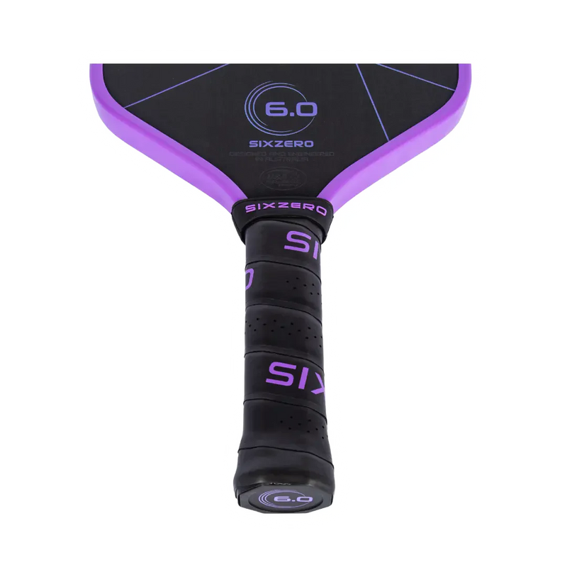 Close-up of a purple and black paddle with 'Sixzero' branding on a white background