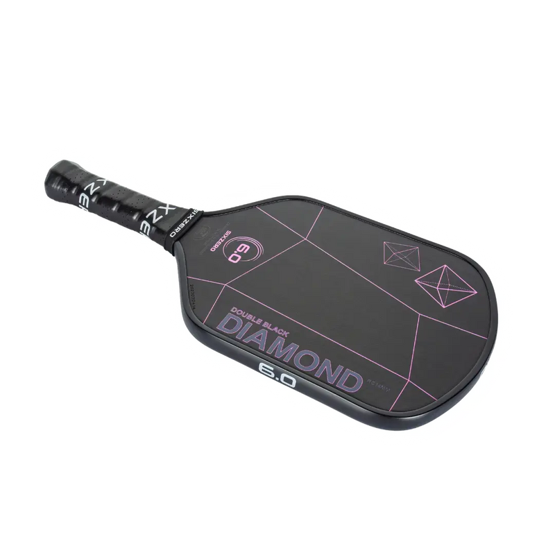 Black pickleball paddle with pink designs on a white background