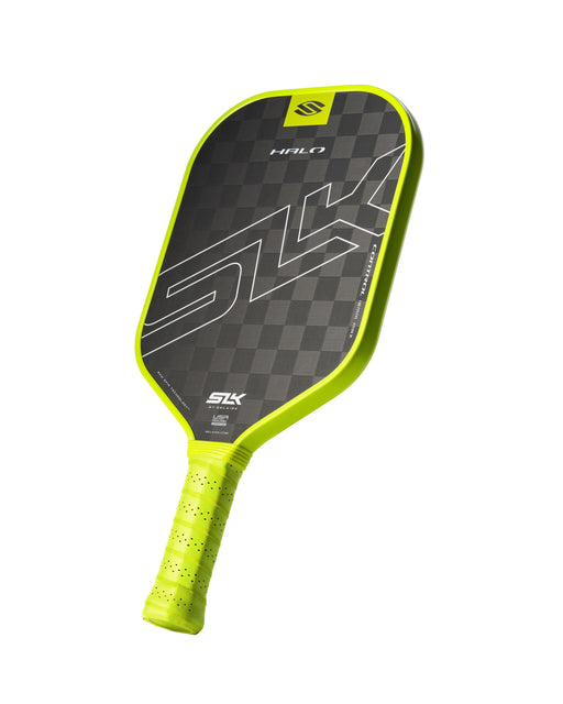Pickleball paddle with black and green design on a white background