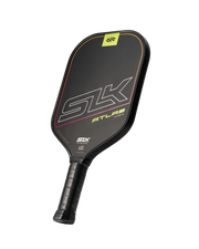Black pickleball paddle with 'SLK' branding on a white background