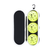 Three pickleballs in a case with a visible brand name on a white background