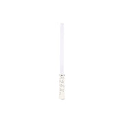 White candle with black polka dots on a white background