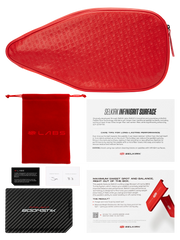Red paddle case with a drawstring bag, carbon fiber sheet, and SELKIRK documentation on a white background.