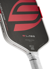 Close-up of a pickleball paddle with a red and black design on a white background