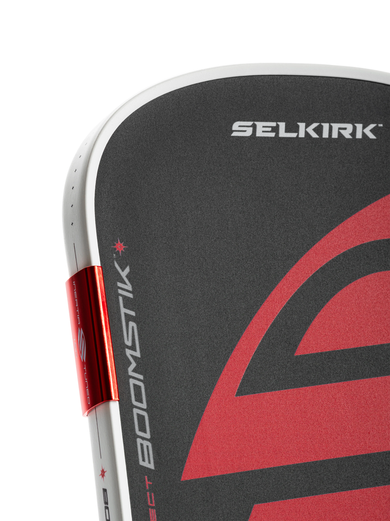 Close-up of a Selkirk paddle with red and black design on a white background