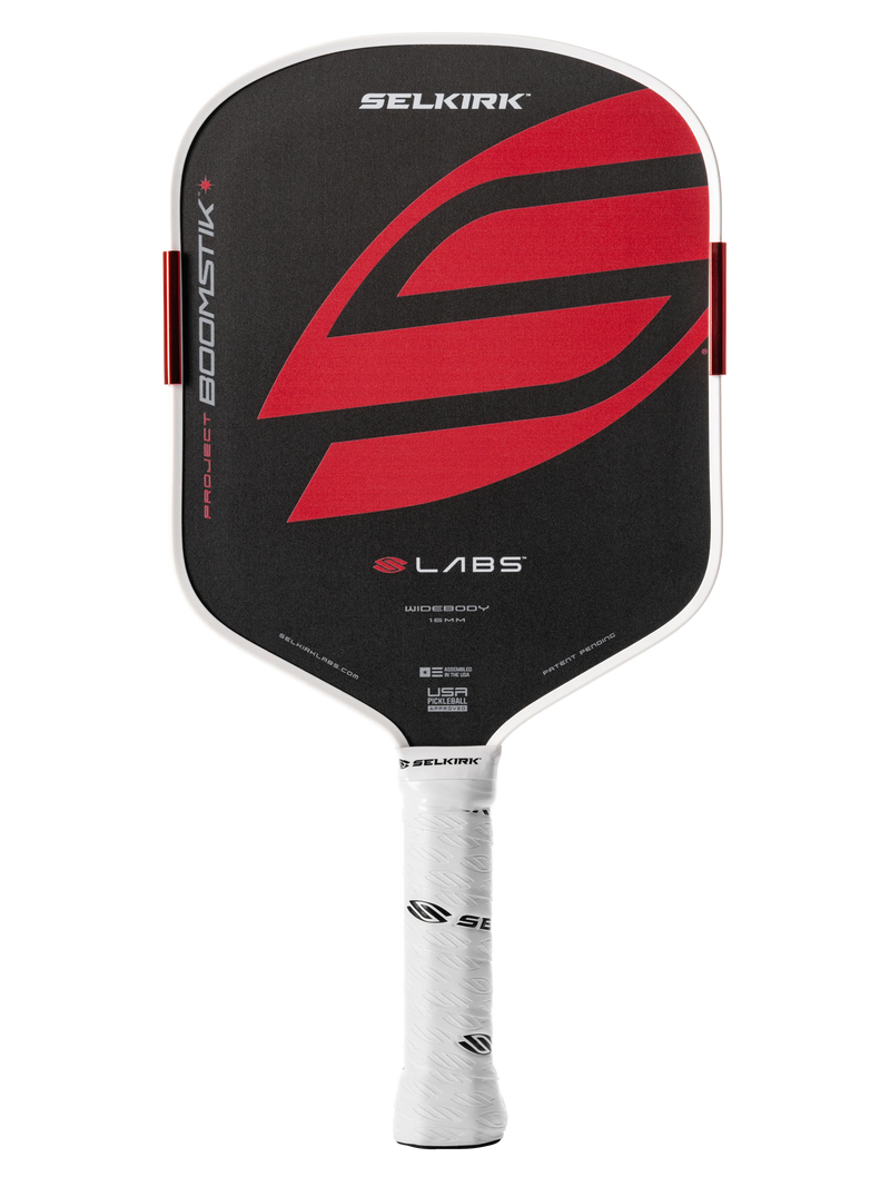 Selkirk pickleball paddle with red and black design on a white background