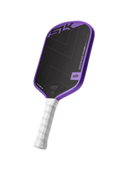 Purple and black pickleball paddle with white handle on a white background