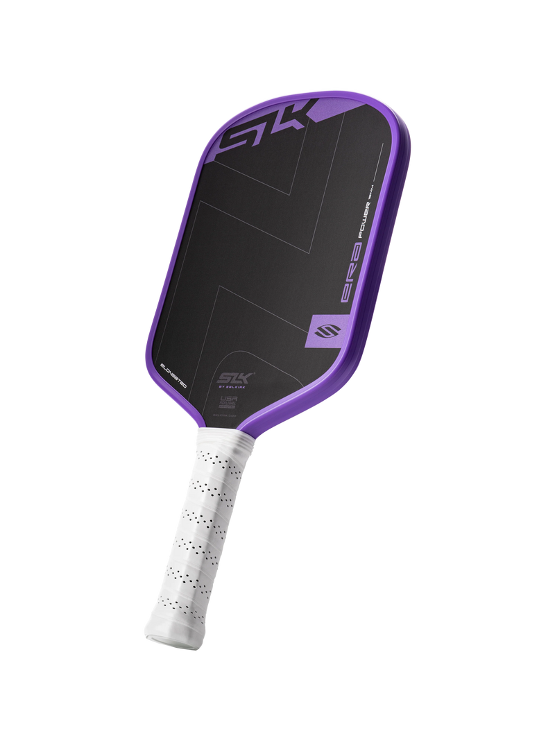 Purple and black pickleball paddle with white handle on a white background