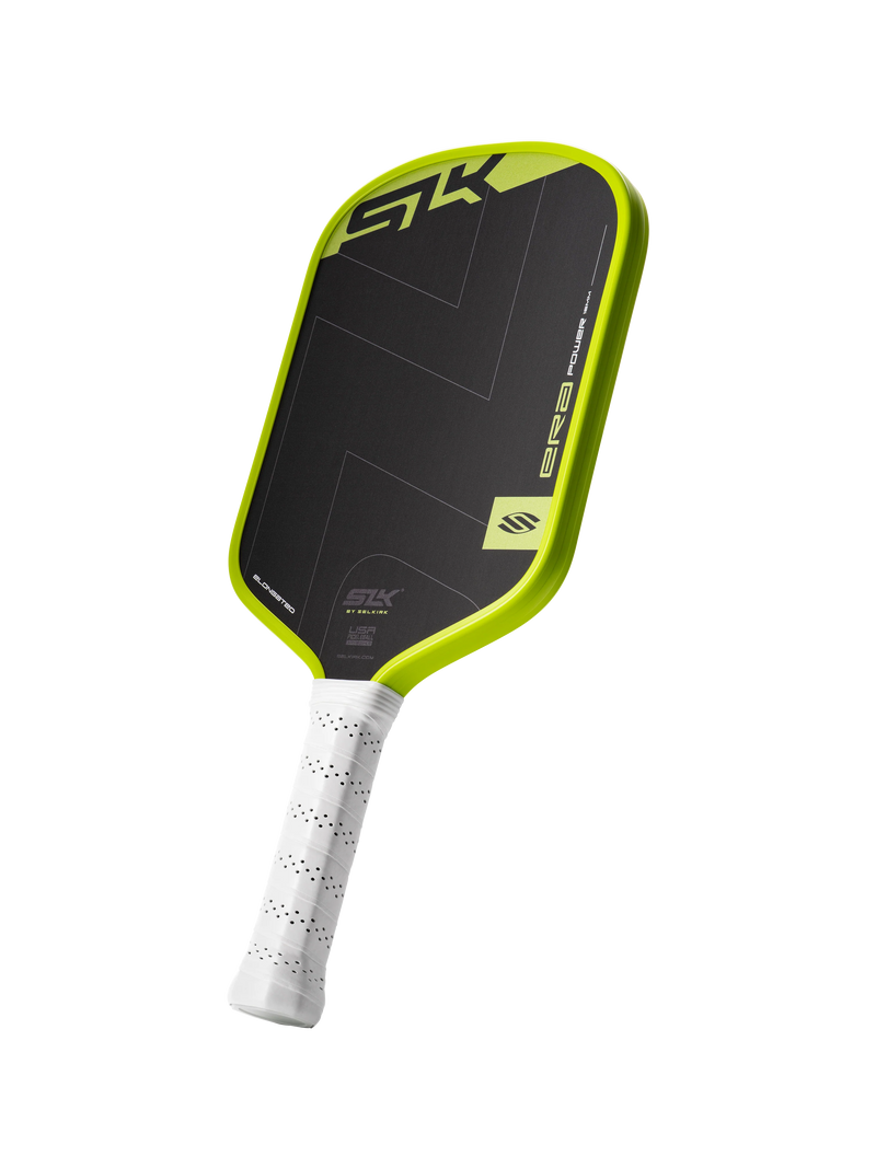 Pickleball paddle with black and green design on a white background