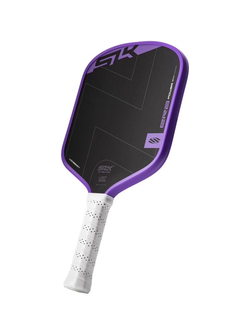 Pickleball paddle with black face and purple rim on a white background