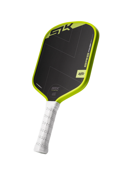 Pickleball paddle with black and green design on a white background