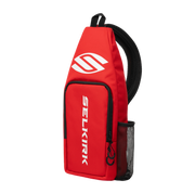 Red sling bag with Selkirk logo on a white background