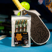 Packaged Edge Guard Tape with pickleball paddle in the background
