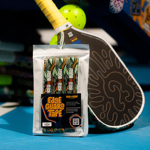 Packaged Edge Guard Tape with pickleball paddle in the background