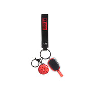 Keychain with paddle and ball charms on a white background