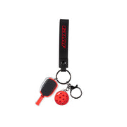 Keychain with paddle and ball charm on a white background