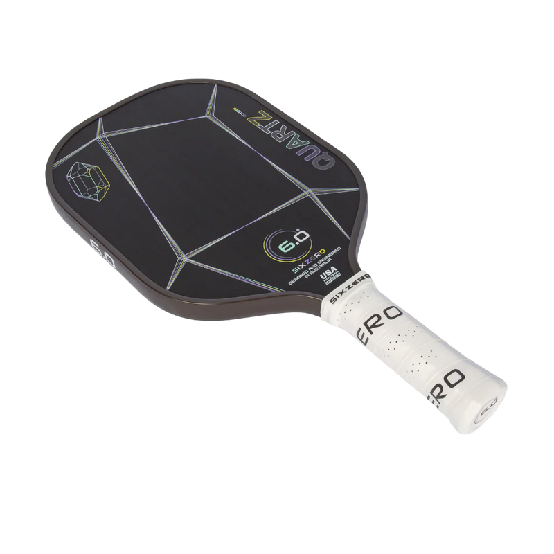 Pickleball paddle with black surface and white handle on a white background