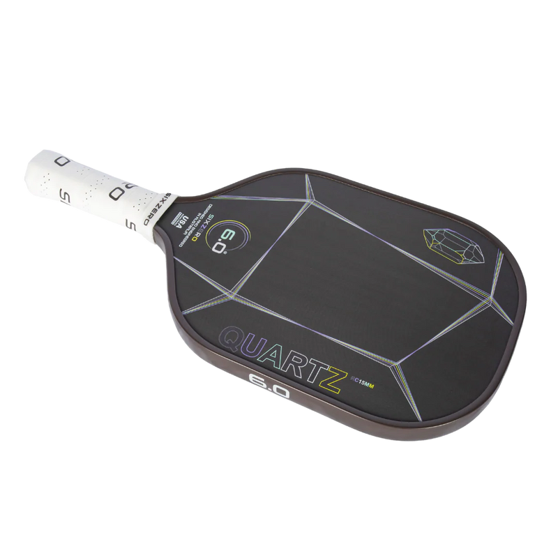 Black pickleball paddle with 'Quartz' branding on a white background