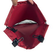 Red drawstring bag with black cord on a white background