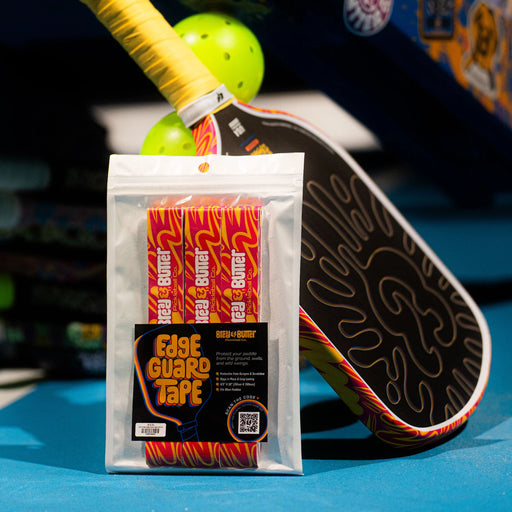 Packaged Edge Guard Tape with a paddle and ball on a blue surface