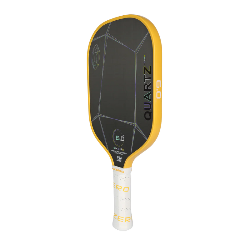 Yellow and black pickleball paddle with 'Quartz' branding on a white background