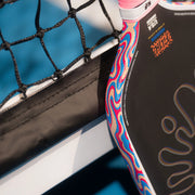 Close-up of a colorful paddle against a blue background