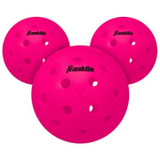 Three pink pickleballs with Franklin logo on a white background