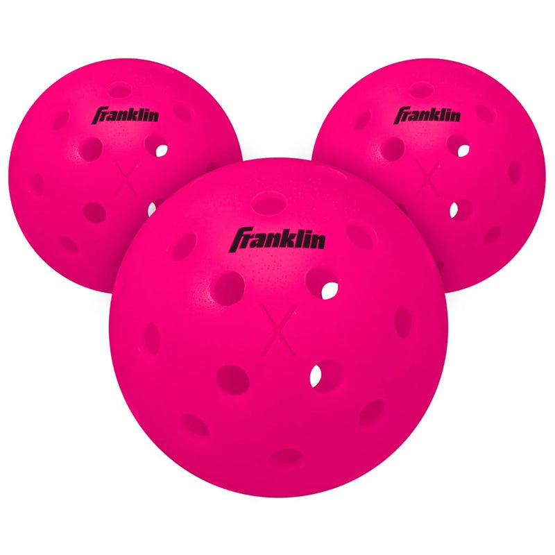 Three pink pickleballs with Franklin logo on a white background