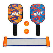 Two NERF branded pickleball paddles with two orange balls and a small pickleball net on a white background.