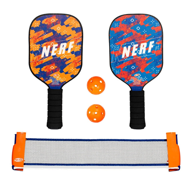 Two NERF branded pickleball paddles with two orange balls and a small pickleball net on a white background.