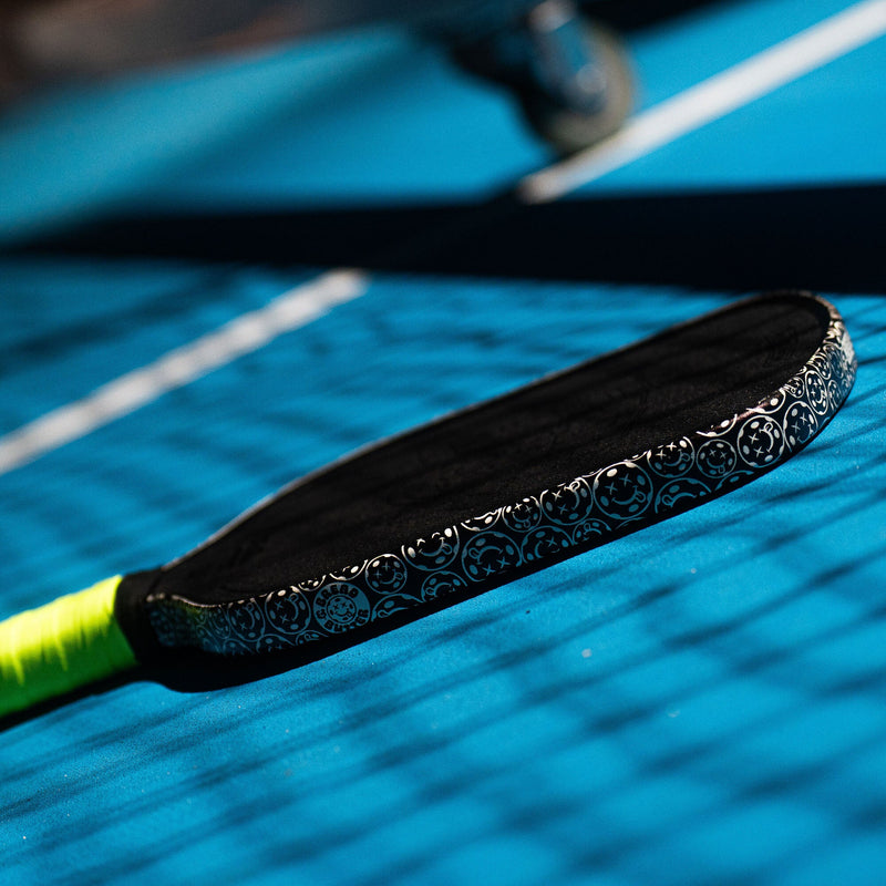 Close-up of a paddle on a blue surface