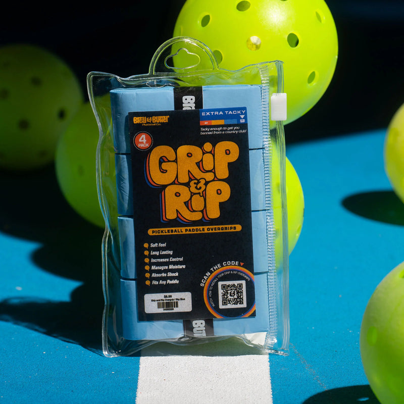 Grip & Rip pickleball paddle overgrip packaging with pickleballs in the background