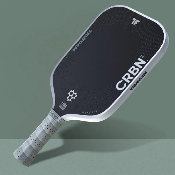 Pickleball paddle with CRBN and TruFom branding on a green background