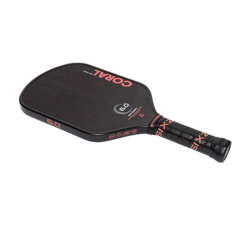 Black pickleball paddle with 'Coral' branding on a white background