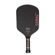 Black pickleball paddle with 'Coral' branding on a white background