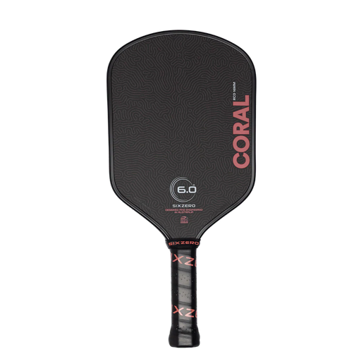 Black pickleball paddle with 'Coral' branding on a white background