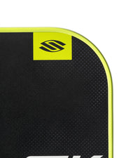 Black textured surface with a yellow logo on a white background